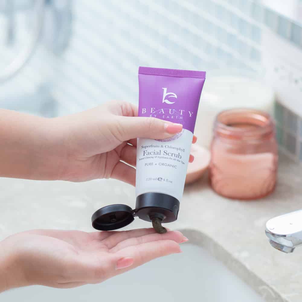 Squeezing Beauty By Earth Facial Scrub into palm
