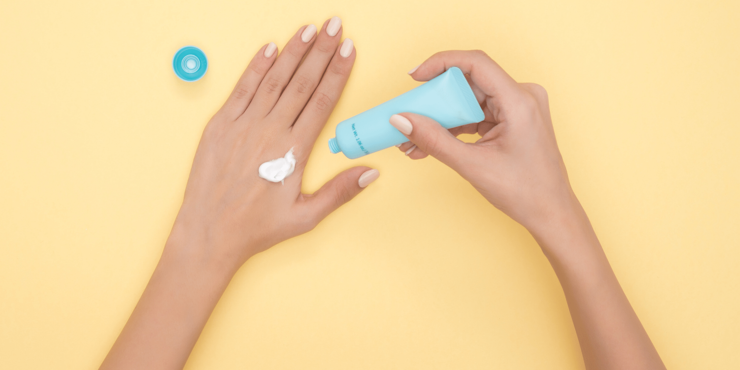 Woman applying sunscreen to her hand